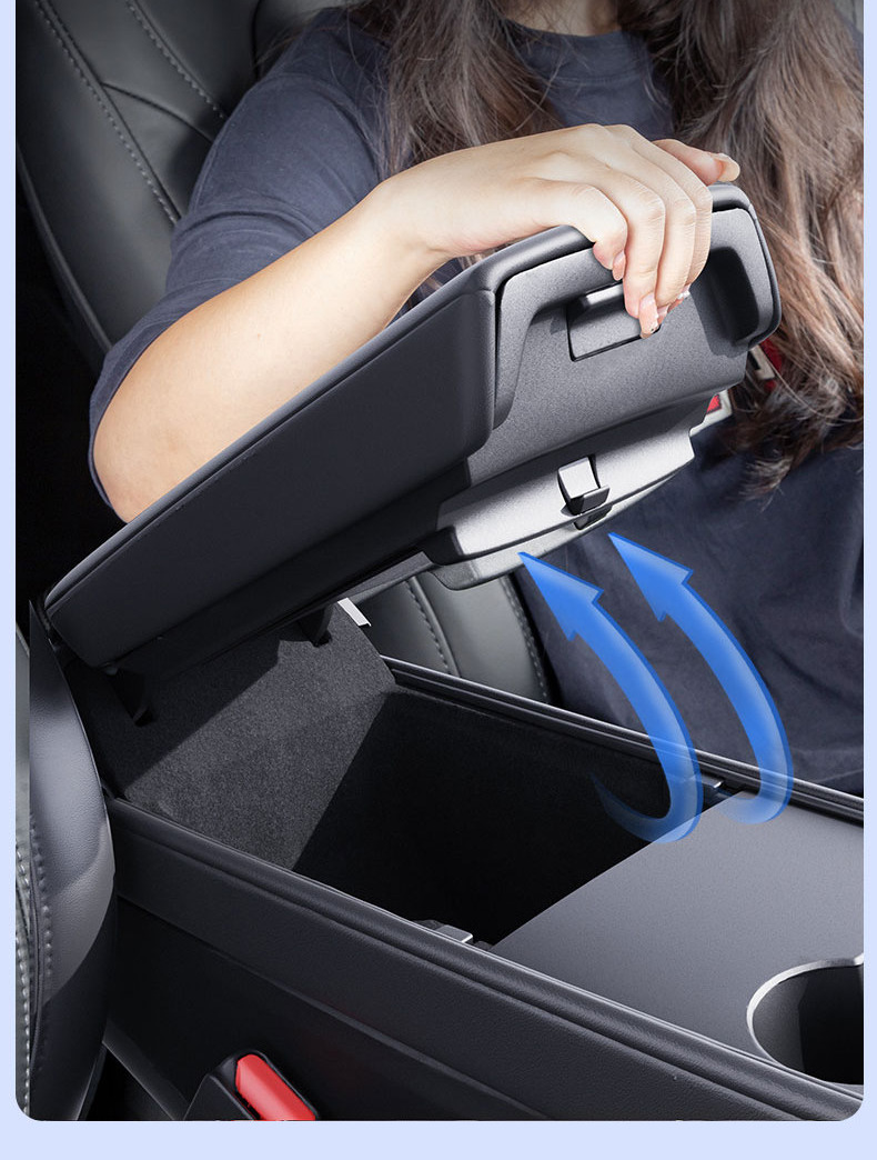 Tesla center armrest lifted while the hidden storage box remains installed