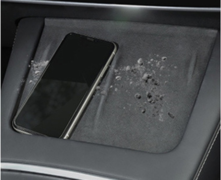 Factory Tesla wireless charging surface before silicone pad