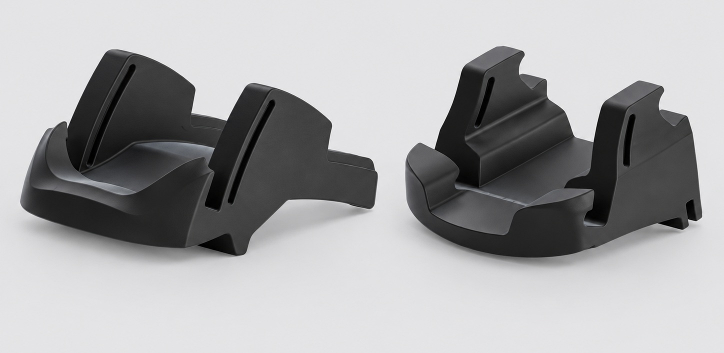 Two fitment-specific Tesla silicone phone holder shapes