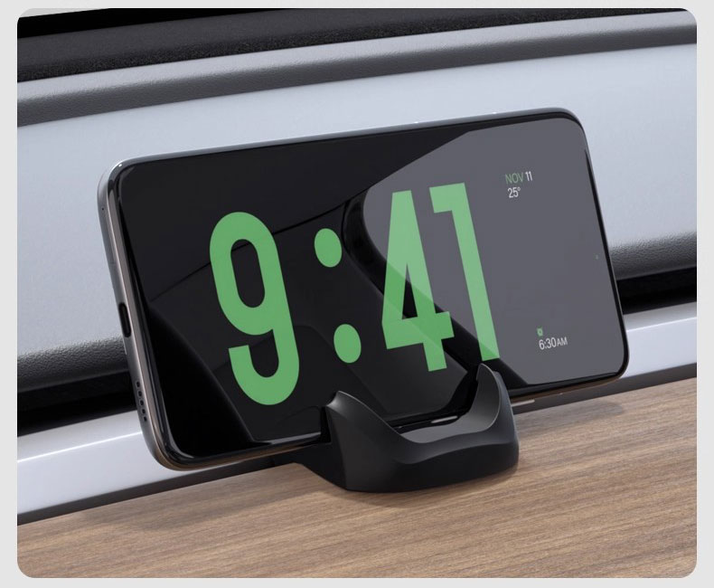 Tesla silicone phone holder shown with a phone on the dashboard