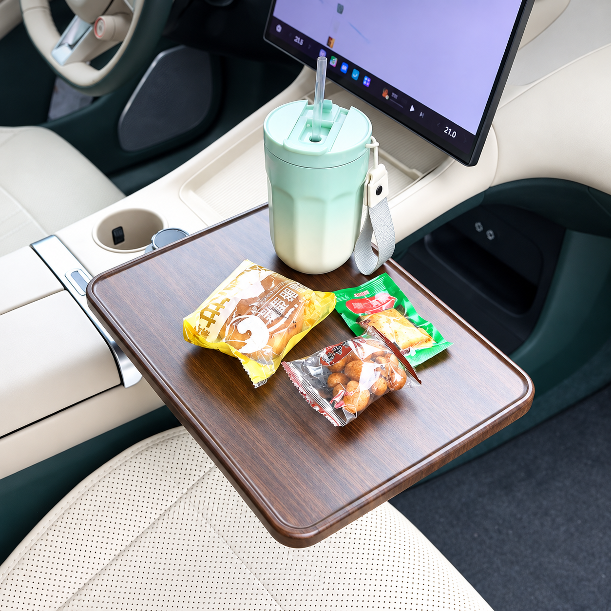 Car cup holder tray table used with snacks inside a vehicle