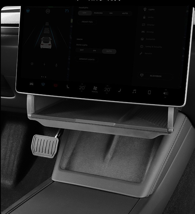 Installed Tesla under-screen organizer integrated below the center screen