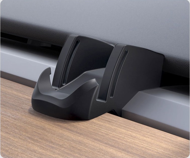 Tesla silicone phone holder shown with a phone on the dashboard