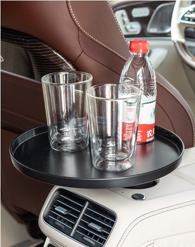 Round car tray holding glasses and a bottle in a rear console