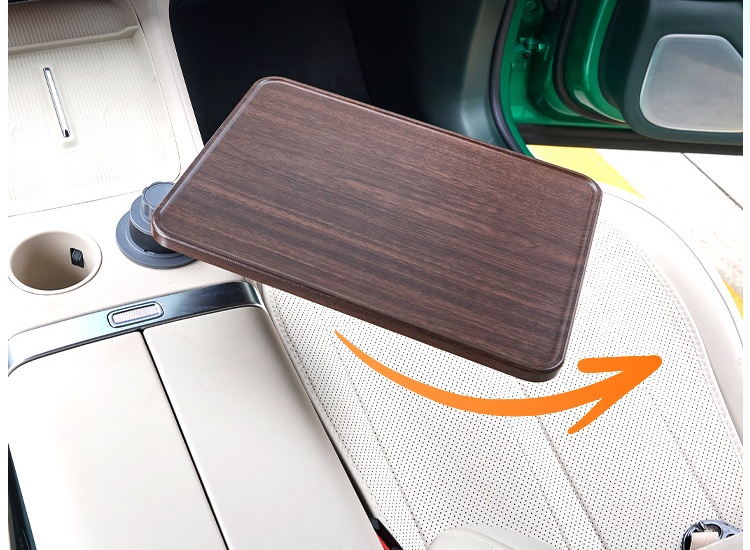 Car cup holder tray rotating over the passenger seat with the mounting base visible