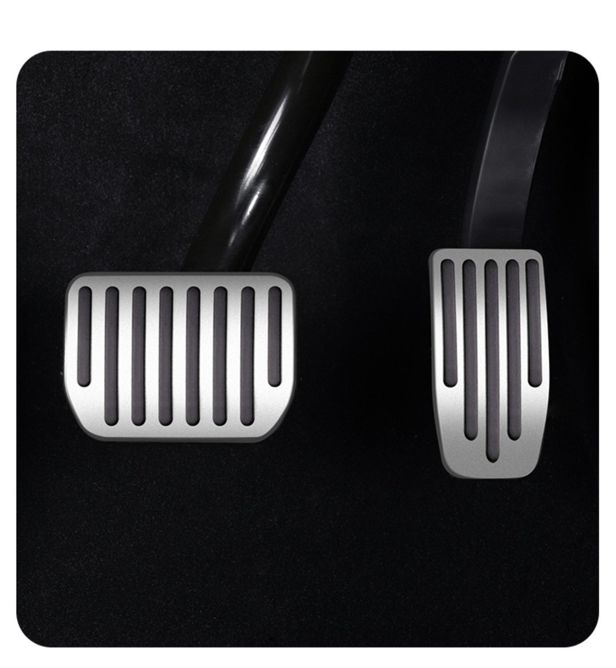 Silver pedal covers installed on Tesla brake and accelerator pedals
