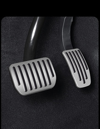 Tesla pedals after installing silver pedal covers