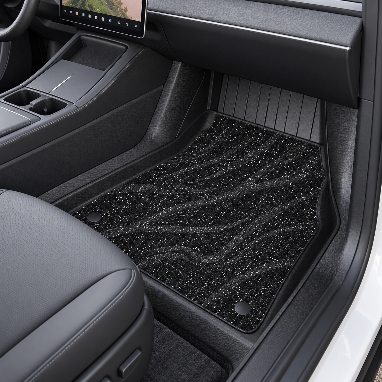 Illustrative black dual-layer floor mat in a refreshed Model Y passenger footwell